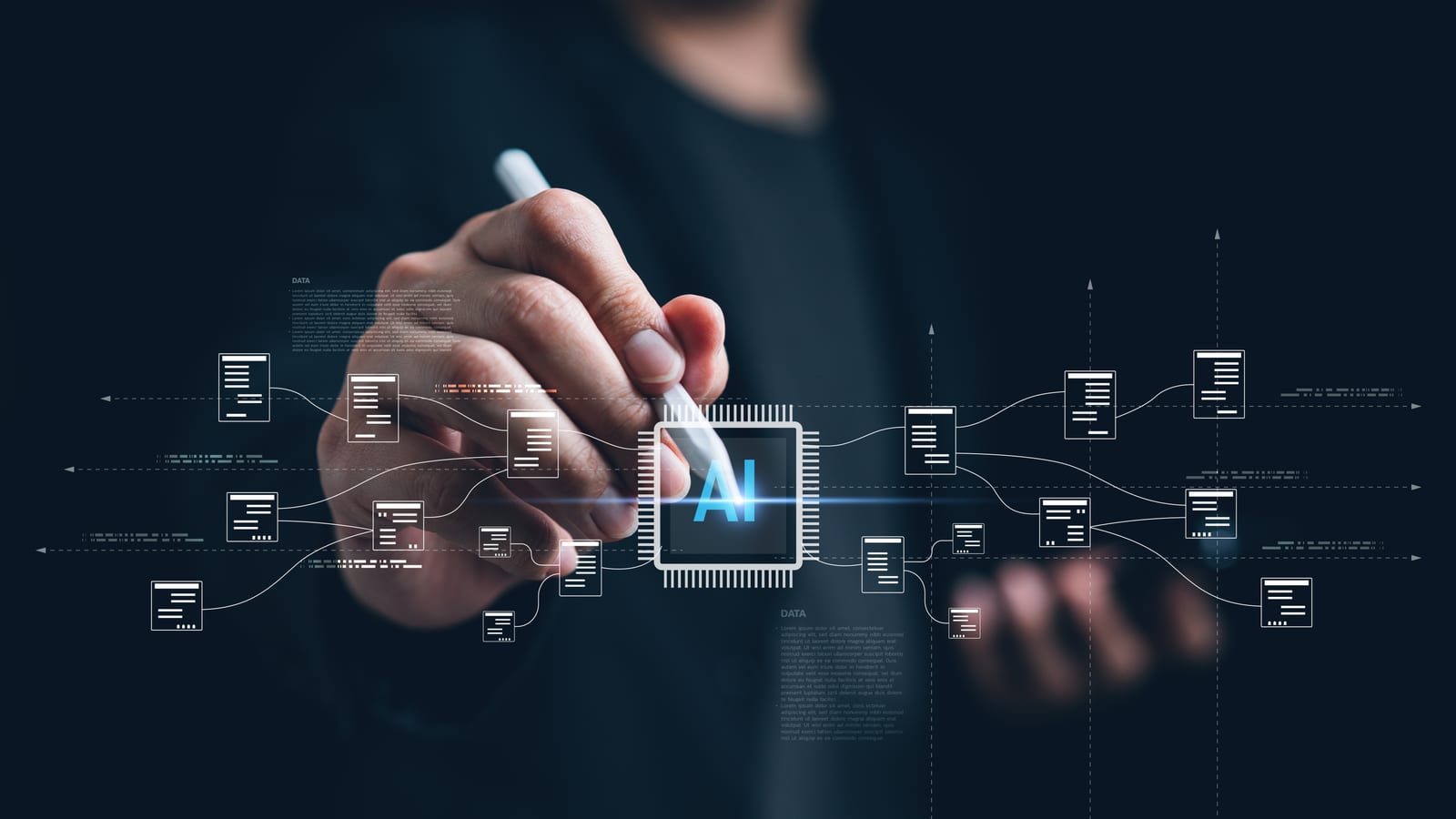 A hand reaching towards a processor icon at the centre of a network of linked boxes, lit pale blue.