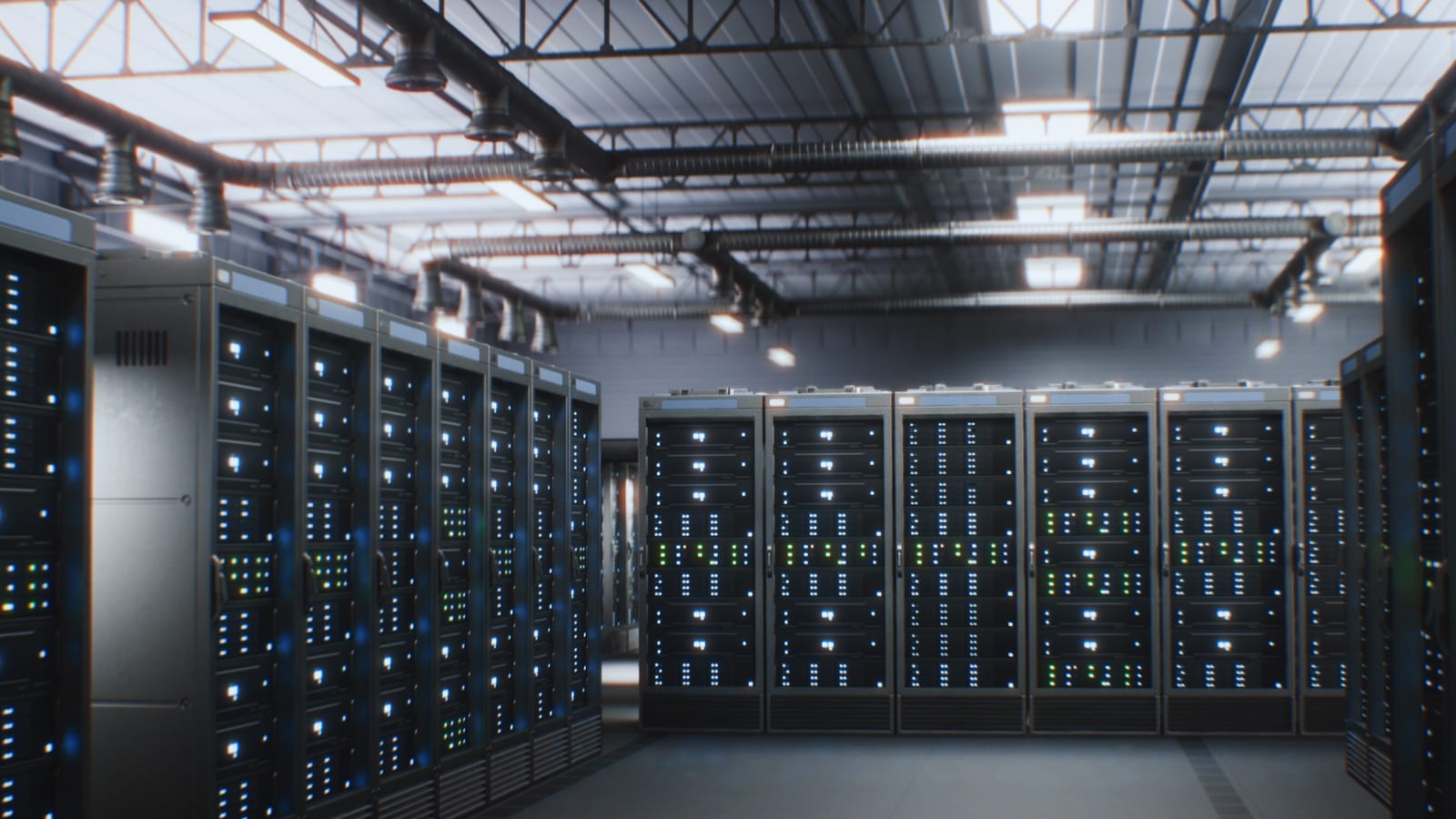 A data centre aisle lined with server racks, lit from the ceiling.